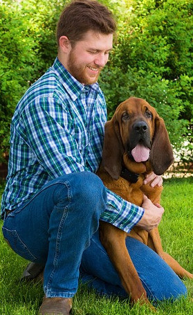 Man hugging dog